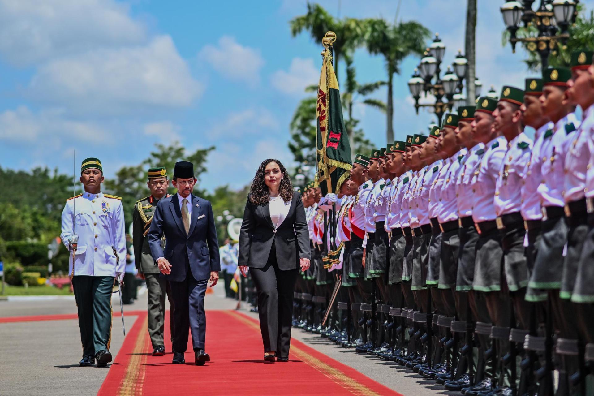 President Vjosa Osmani-Sadriu inspects the royal guard of honor.