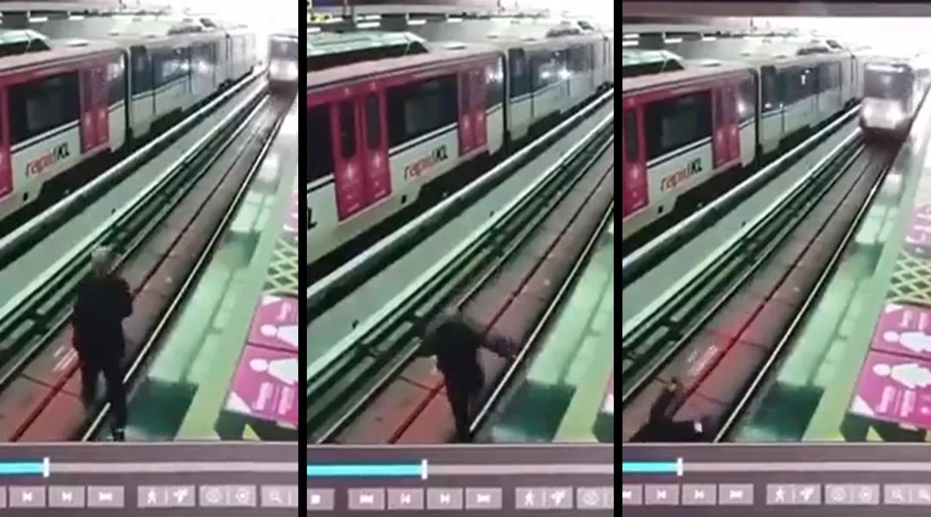 男子似无意中踩空跌落轨道。（电眼视频画面截图）