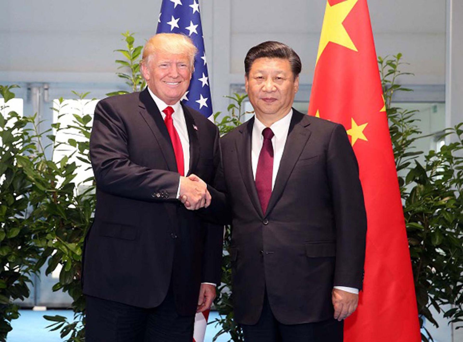 美国总统特朗普（左）期待尽快与中国国家主席习近平（右）见面。（档案照）