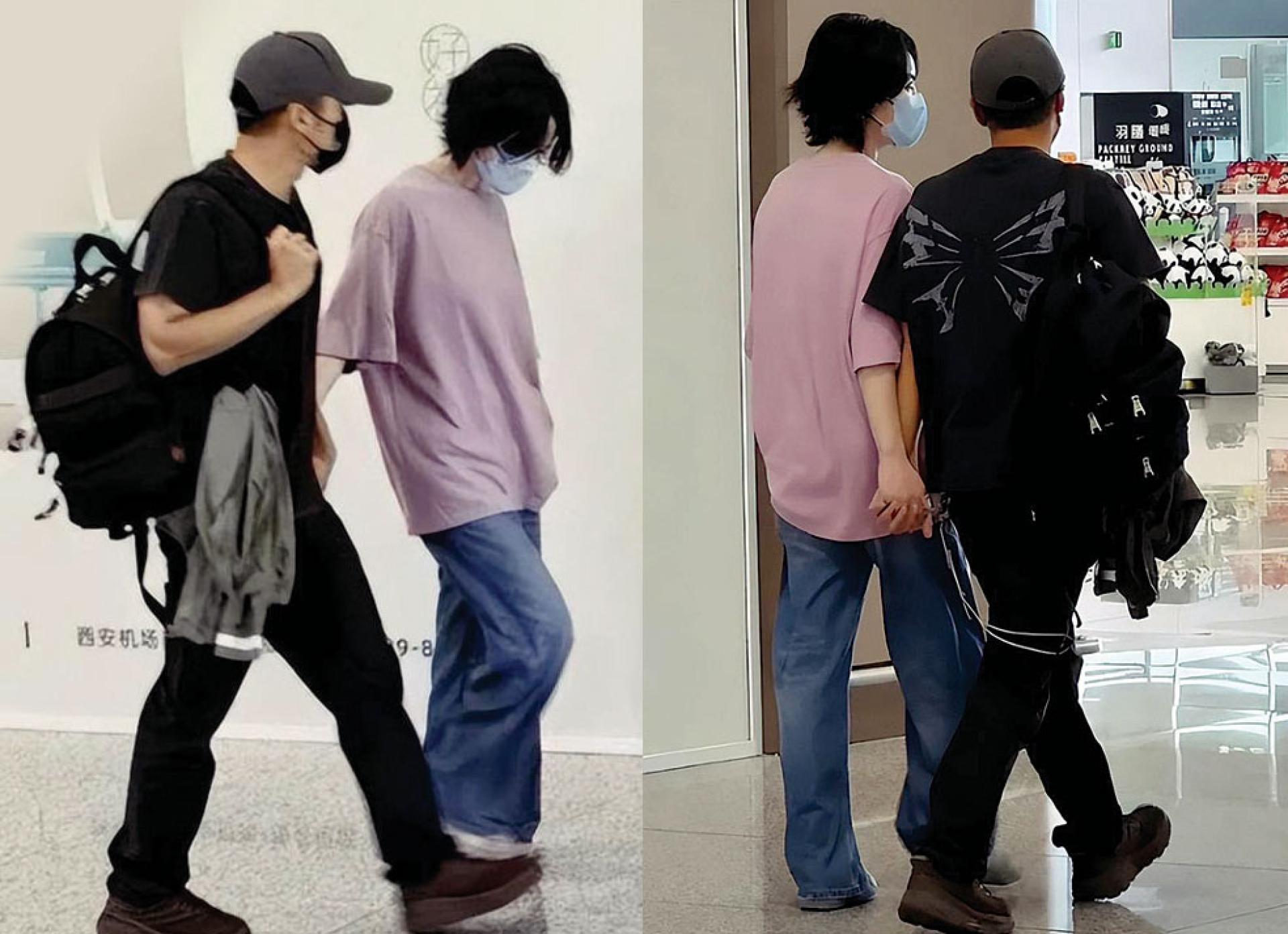王菲、谢霆锋十指紧扣离开西安。