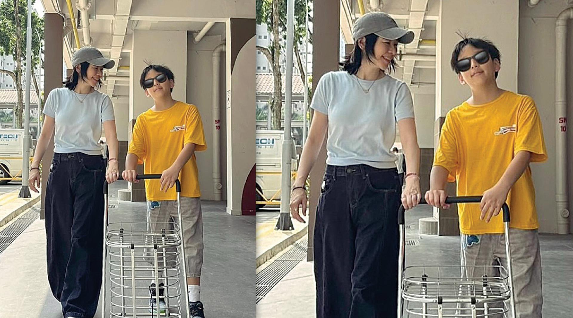 徐若瑄带儿子一起做义工。